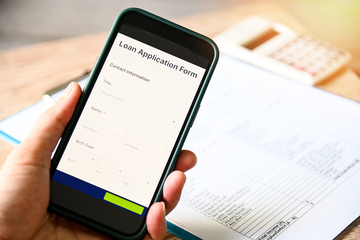 Someone searching for loans on a phone, wondering how to get a loan online instantly