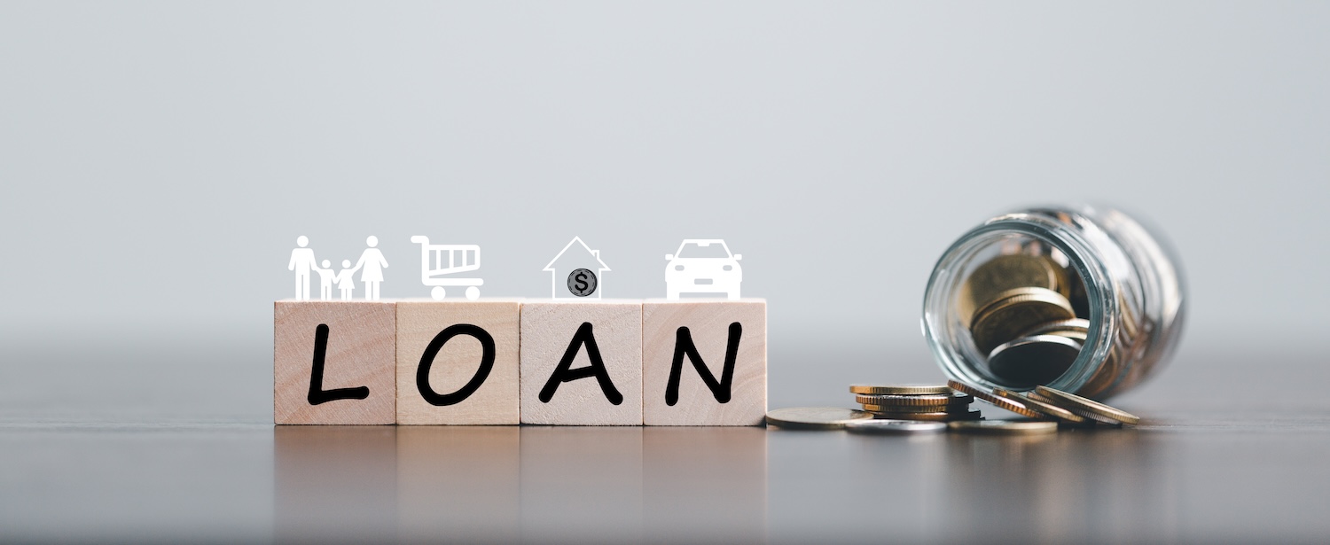 Blocks spelling out 'loan' with an image of family, a shopping cart, a house and a car to represent 'What Can Personal Loans Be Used For?'