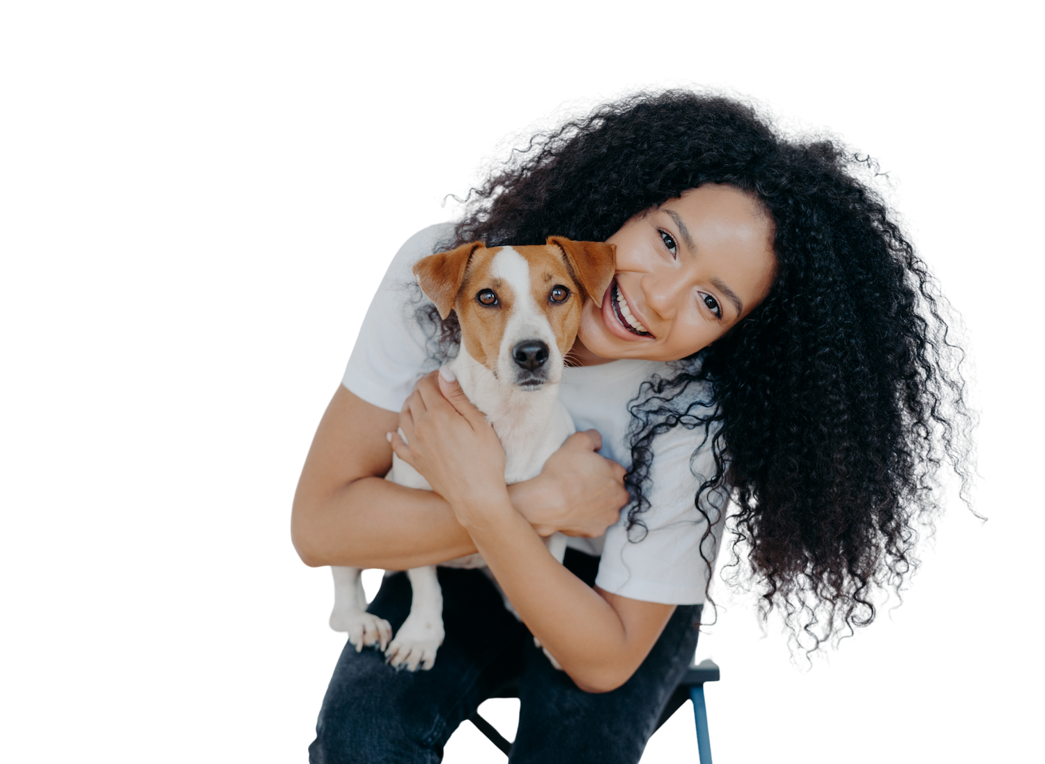 A woman holding her dog, celebrating she found veterinary financing