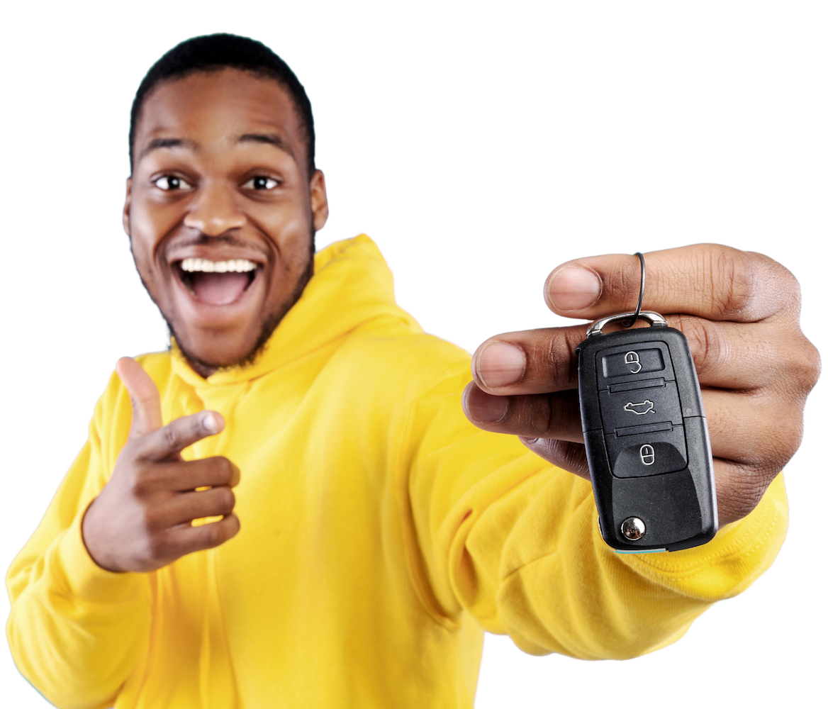 A man holding his car keys, excited because he got a personal loan for auto repair