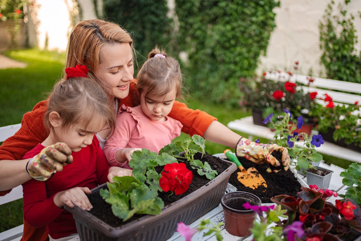 A family working on their garden because of a landscaping loan