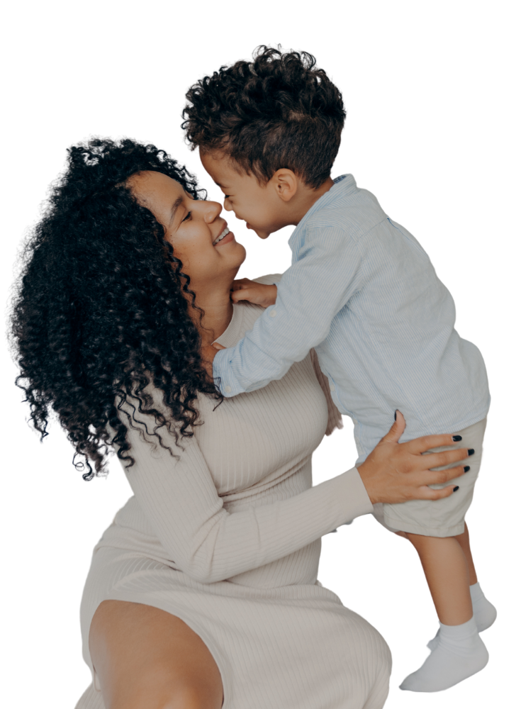 A woman holding her son and smiling because she was able to get a childcare loan