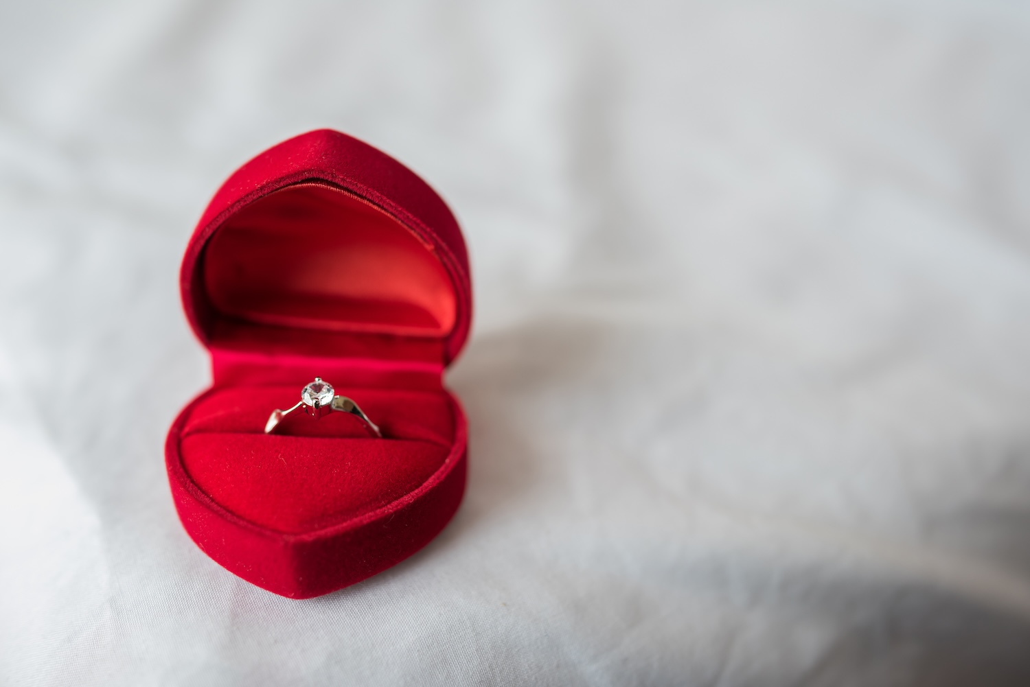 An engagement ring in a heart shaped box