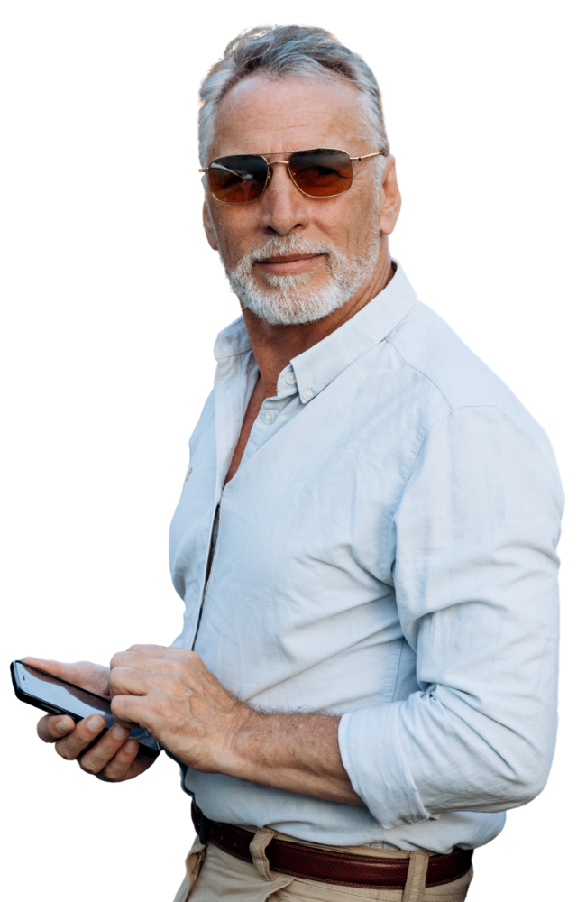 A rideshare driver holding his phone to represent personal loans for uber drivers